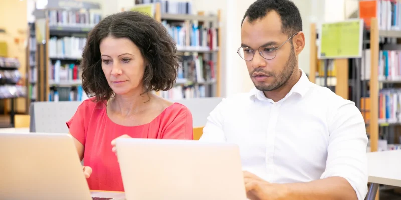 adult-student-cheating-during-test-in-library